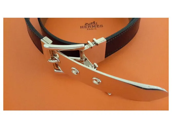 Hermès Caja marrón oscuro y metal dorado 